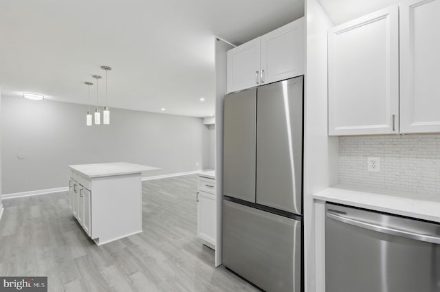 2310 Ewing Ave Unit 203, Suitland, MD 20746 - kitchen with stainless steel appliances, backsplash, and white cabinets