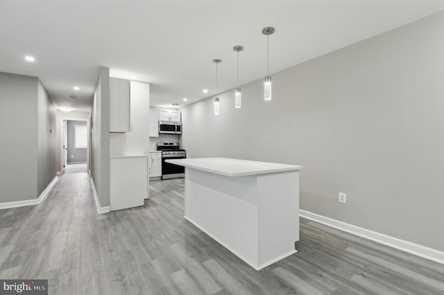 2310 Ewing Ave Unit 203, Suitland, MD 20746 - kitchen with appliances with stainless steel finishes, light wood finished floors, white cabinets, light countertops, and recessed lighting