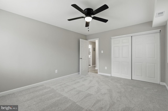 2310 Ewing Ave Unit 203, Suitland, MD 20746 - unfurnished bedroom featuring a closet, carpet floors, and a ceiling fan