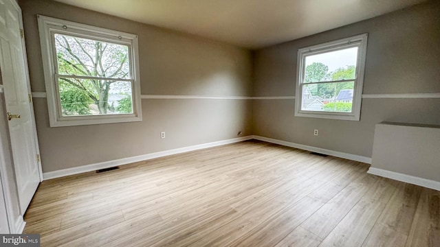 40 Marshal Ln, Willingboro, NJ 08046 - spare room featuring plenty of natural light, wood finished floors, and baseboards