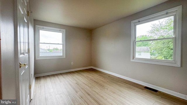 40 Marshal Ln, Willingboro, NJ 08046 - empty room with healthy amount of natural light, light wood-type flooring, and baseboards