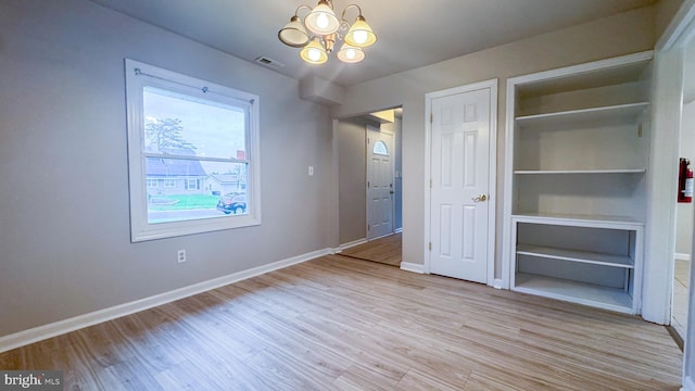 40 Marshal Ln, Willingboro, NJ 08046 - unfurnished dining area featuring a chandelier, wood finished floors, and baseboards