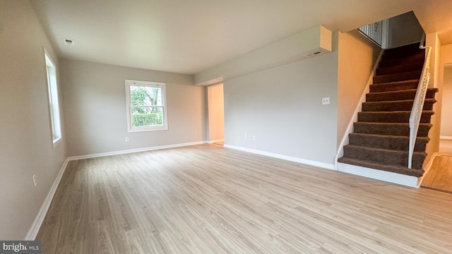 40 Marshal Ln, Willingboro, NJ 08046 - unfurnished living room with light wood-style flooring, stairs, and baseboards