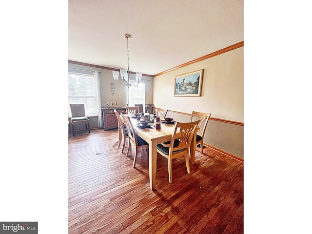169 Fieldbrook Dr, Magnolia, DE 19962 - dining room with crown molding, a chandelier, and hardwood / wood-style flooring