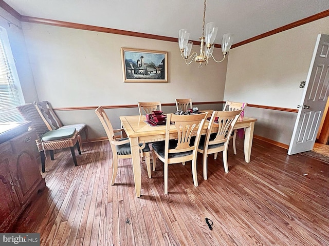 169 Fieldbrook Dr, Magnolia, DE 19962 - dining area featuring ornamental molding, hardwood / wood-style flooring, a chandelier, and baseboards