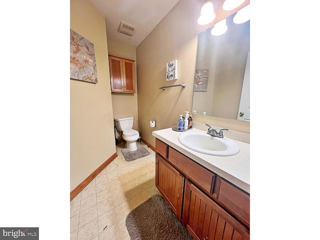 169 Fieldbrook Dr, Magnolia, DE 19962 - bathroom with toilet, baseboards, and vanity