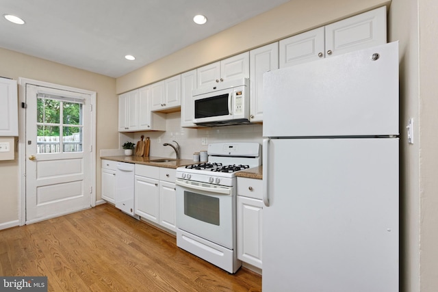 417 Gibbon St, Alexandria, VA 22314 - kitchen with white appliances, a sink, white cabinetry, recessed lighting, and backsplash