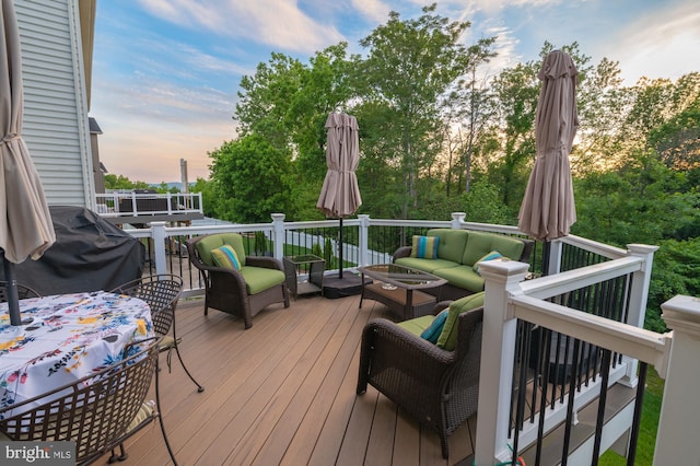 1145 Dargon Quarry Ln, Brunswick, MD 21716 - deck at dusk featuring an outdoor living space, grilling area, and view of scattered trees