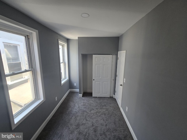 1361 Park Blvd, Camden, NJ 08103 - unfurnished bedroom featuring dark carpet and baseboards
