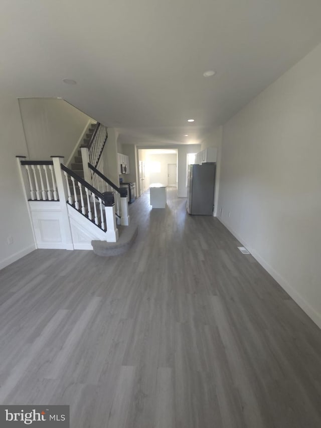 1361 Park Blvd, Camden, NJ 08103 - unfurnished living room with dark wood-style floors, stairway, and recessed lighting