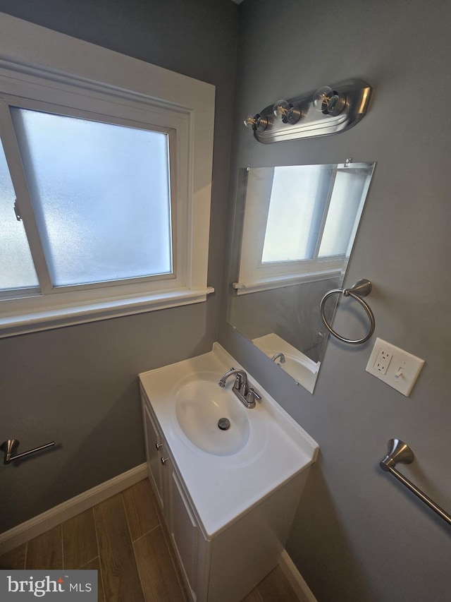 1361 Park Blvd, Camden, NJ 08103 - bathroom with plenty of natural light, vanity, and wood finished floors