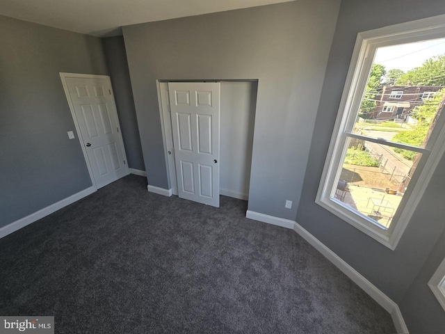1361 Park Blvd, Camden, NJ 08103 - unfurnished bedroom with dark carpet and baseboards