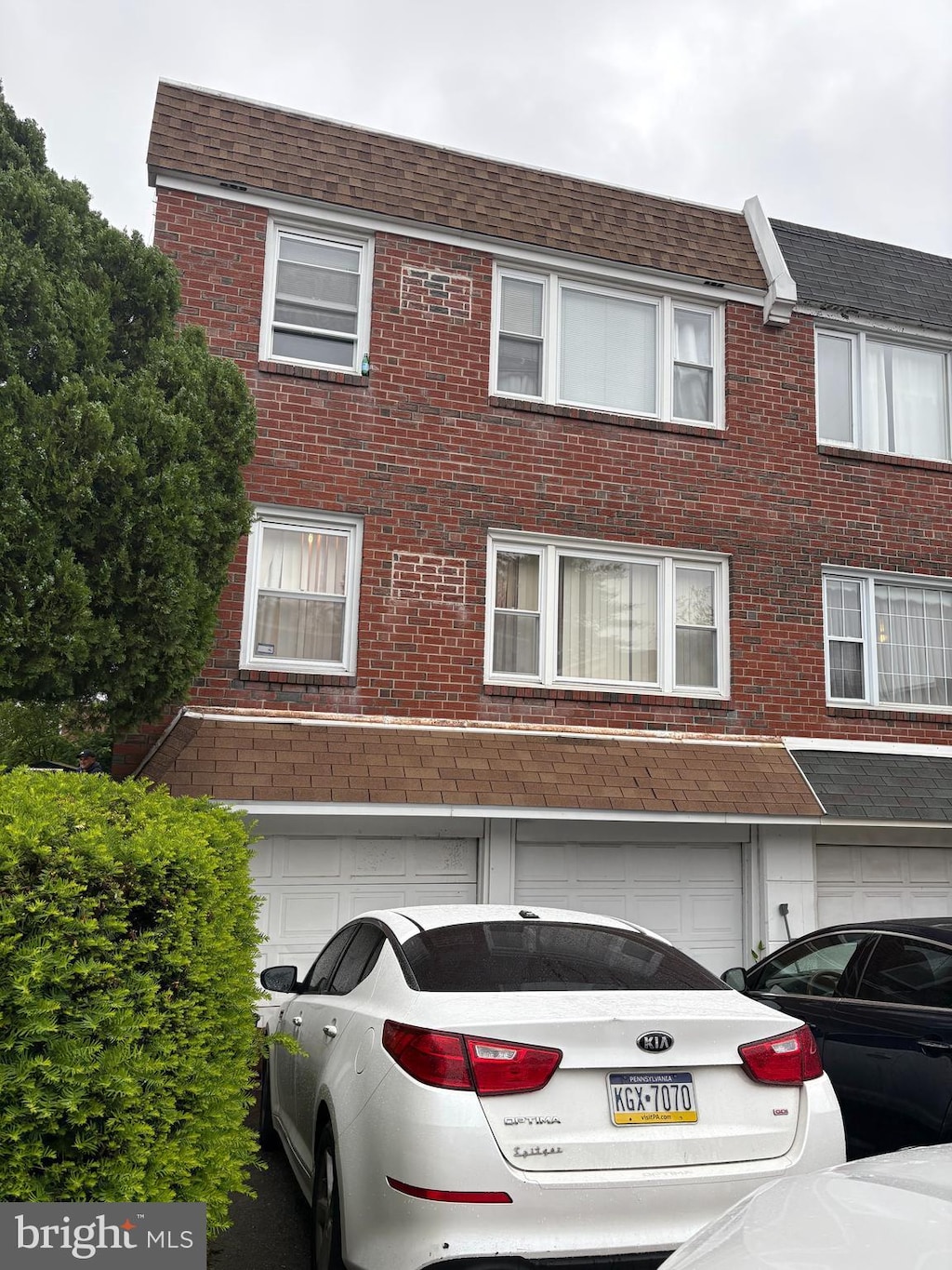 250 Nandina Plz, Philadelphia, PA 19116 - multi unit property with a shingled roof, brick siding, and a garage