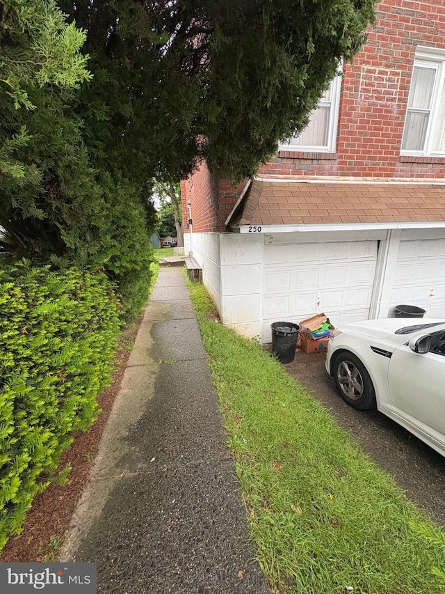 250 Nandina Plz, Philadelphia, PA 19116 - view of home's exterior with brick siding and a garage