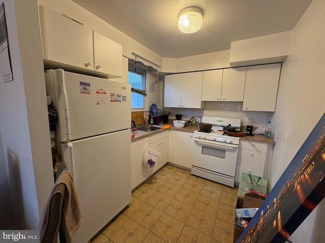 250 Nandina Plz, Philadelphia, PA 19116 - kitchen featuring white appliances, a sink, white cabinets, and light countertops