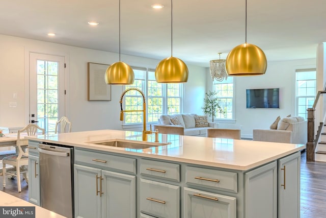 15634 Calum Ct, Haymarket, VA 20169 - kitchen featuring stainless steel dishwasher, a sink, open floor plan, plenty of natural light, and recessed lighting