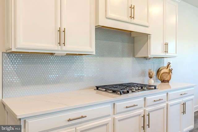 15634 Calum Ct, Haymarket, VA 20169 - kitchen with decorative backsplash, stainless steel gas stovetop, and white cabinetry