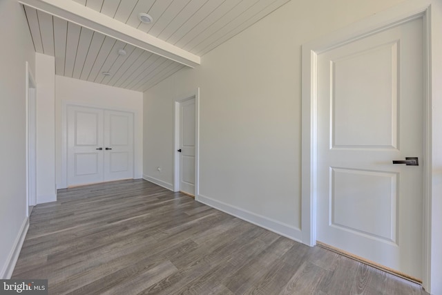 15634 Calum Ct, Haymarket, VA 20169 - hallway featuring wood finished floors, wooden ceiling with exposed beams, and baseboards