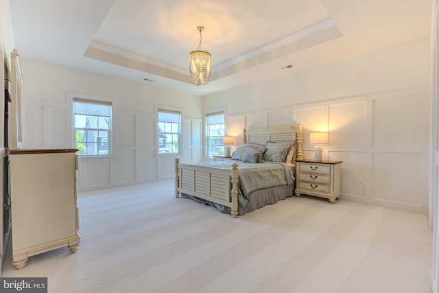 15634 Calum Ct, Haymarket, VA 20169 - bedroom with a decorative wall, a chandelier, a tray ceiling, crown molding, and light carpet