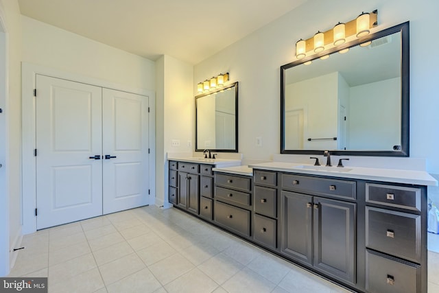 15634 Calum Ct, Haymarket, VA 20169 - bathroom with double vanity, tile patterned floors, and baseboards