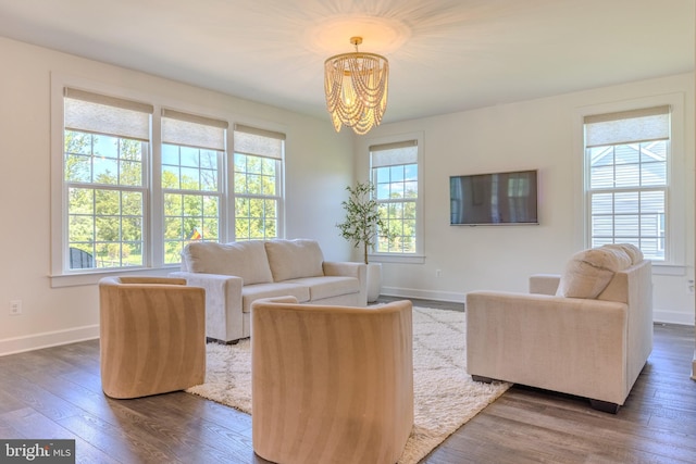 15634 Calum Ct, Haymarket, VA 20169 - living area with a chandelier, dark wood finished floors, and baseboards