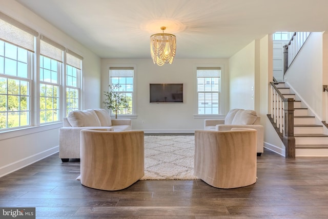 15634 Calum Ct, Haymarket, VA 20169 - living area with stairway, healthy amount of natural light, a chandelier, and dark wood-style flooring