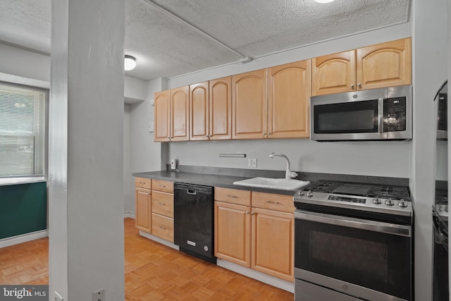 1801 Clydesdale Pl NW Unit 420, Washington, DC 20009 - kitchen with stainless steel appliances, a sink, light brown cabinetry, a textured ceiling, and dark countertops