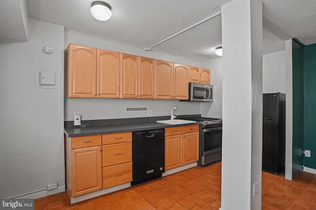 1801 Clydesdale Pl NW Unit 420, Washington, DC 20009 - kitchen with black appliances, a textured ceiling, dark countertops, a sink, and light brown cabinetry