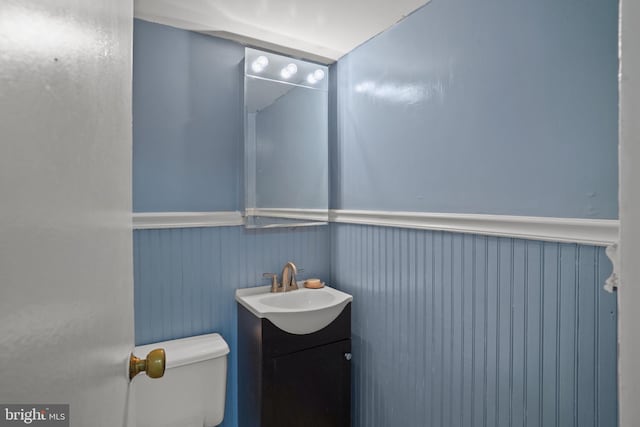 1801 Clydesdale Pl NW Unit 420, Washington, DC 20009 - bathroom with wainscoting, vanity, and toilet