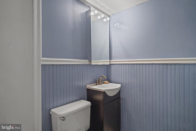 1801 Clydesdale Pl NW Unit 420, Washington, DC 20009 - half bath featuring vanity, toilet, and wainscoting