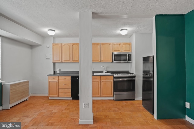 1801 Clydesdale Pl NW Unit 420, Washington, DC 20009 - kitchen with black appliances, light brown cabinets, baseboards, a textured ceiling, and a sink