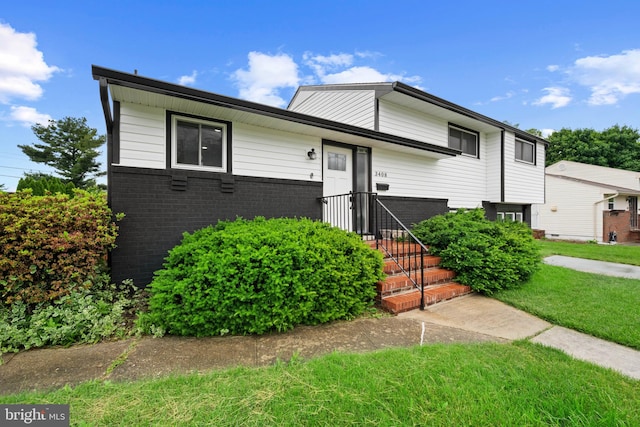 3408 Croydon Rd, Gwynn Oak, MD 21207 - split level home featuring brick siding and a front yard