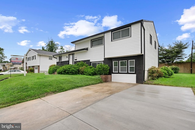 3408 Croydon Rd, Gwynn Oak, MD 21207 - split level home featuring a front yard, concrete driveway, and a patio