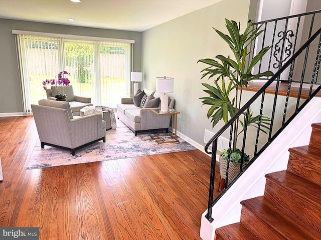 3408 Croydon Rd, Gwynn Oak, MD 21207 - living area with baseboards, stairway, wood finished floors, and recessed lighting