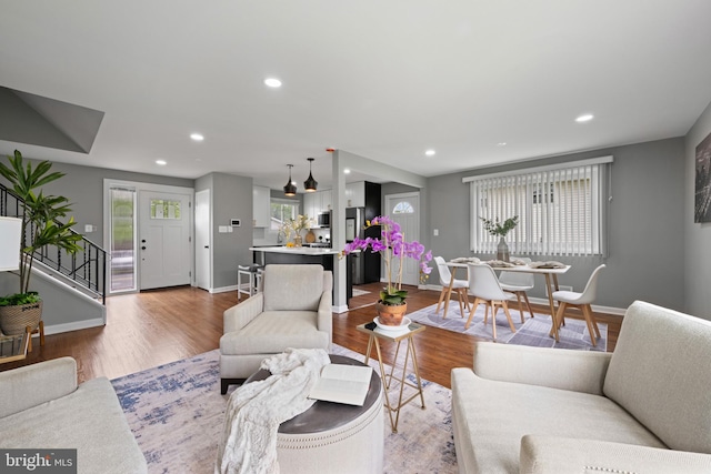 3408 Croydon Rd, Gwynn Oak, MD 21207 - living room featuring wood finished floors, baseboards, recessed lighting, and stairs
