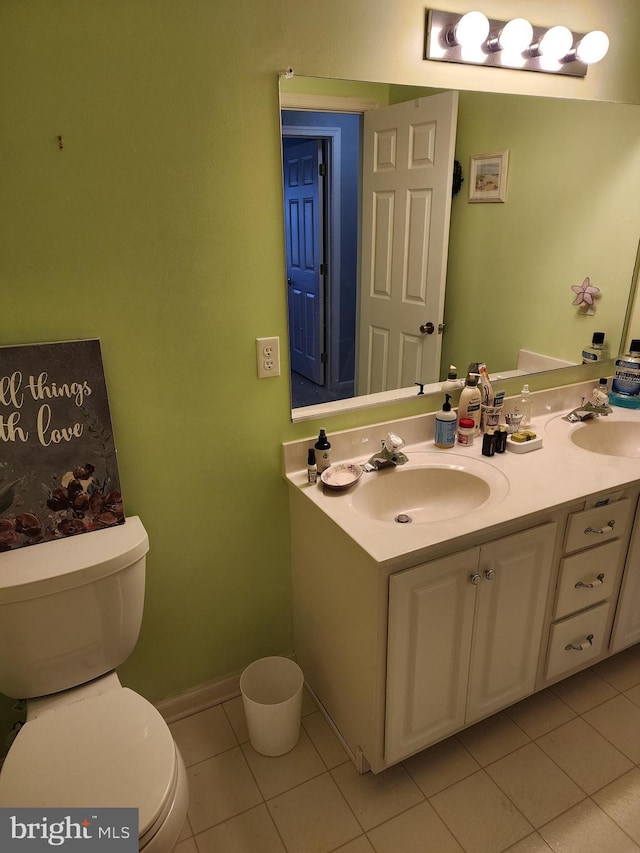 37484 Pettinaro Dr Unit 8300, Ocean View, DE 19970 - bathroom with toilet, tile patterned floors, double vanity, and baseboards