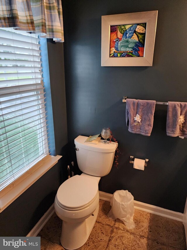 37484 Pettinaro Dr Unit 8300, Ocean View, DE 19970 - bathroom featuring toilet, baseboards, and tile patterned flooring