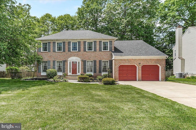 614 Timber Wood Blvd, Newark, DE 19702 - colonial home with an attached garage, brick siding, driveway, central AC, and a shingled roof