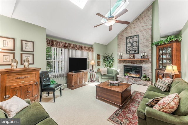 614 Timber Wood Blvd, Newark, DE 19702 - carpeted living room featuring a fireplace, high vaulted ceiling, a ceiling fan, and a skylight