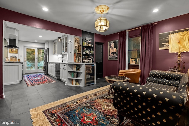 12 Chestnut Ln, Wayne, PA 19087 - bar area with wine cooler, freestanding refrigerator, dishwashing machine, recessed lighting, and dark tile patterned floors