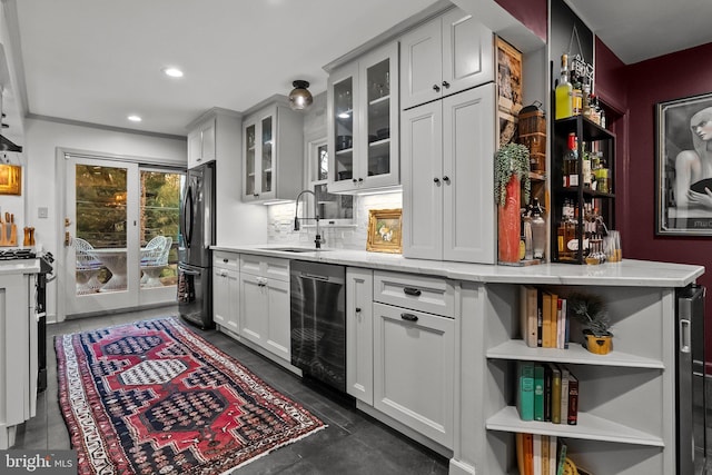 12 Chestnut Ln, Wayne, PA 19087 - bar with stainless steel dishwasher, freestanding refrigerator, a sink, tasteful backsplash, and recessed lighting