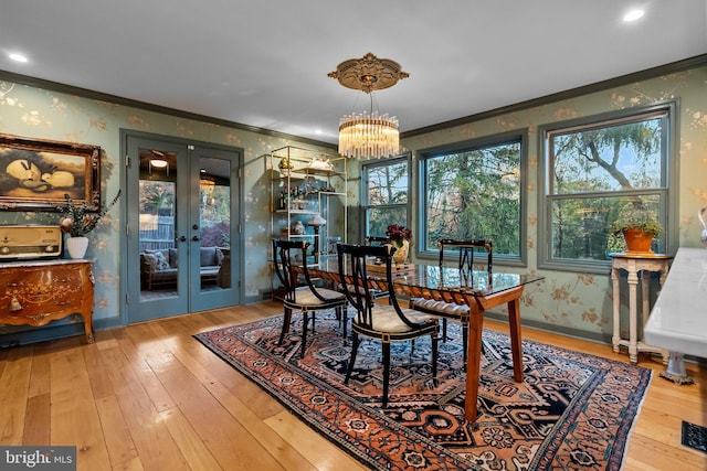 12 Chestnut Ln, Wayne, PA 19087 - dining room featuring crown molding, wood-type flooring, french doors, a chandelier, and baseboards