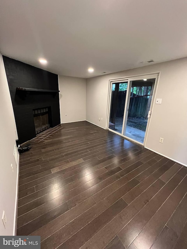 19 Wolf Trap, Baltimore, MD 21236 - unfurnished living room with a large fireplace, dark wood-style floors, and recessed lighting