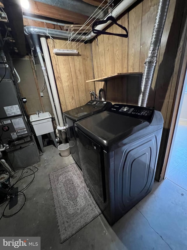 19 Wolf Trap, Baltimore, MD 21236 - laundry room with washing machine and clothes dryer and wood walls