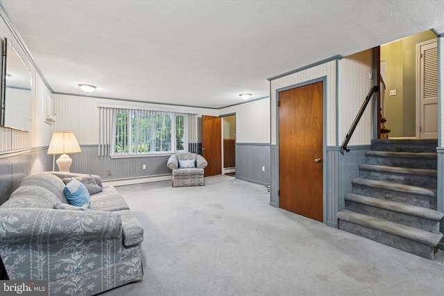 711 Pikeland Ave, Spring City, PA 19475 - living area featuring a baseboard heating unit, wainscoting, stairs, carpet floors, and wallpapered walls