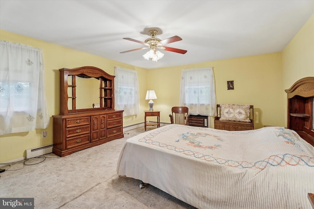 711 Pikeland Ave, Spring City, PA 19475 - carpeted bedroom with a baseboard heating unit, baseboards, and a ceiling fan