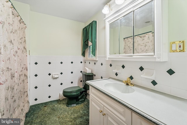 711 Pikeland Ave, Spring City, PA 19475 - bathroom with vanity, toilet, tile walls, curtained shower, and a wainscoted wall