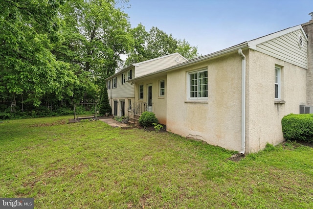 711 Pikeland Ave, Spring City, PA 19475 - back of property featuring stucco siding and a lawn
