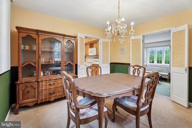 711 Pikeland Ave, Spring City, PA 19475 - dining area with light carpet and a chandelier