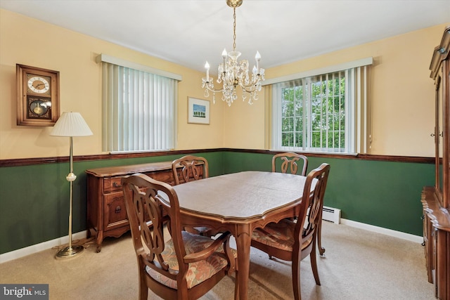 711 Pikeland Ave, Spring City, PA 19475 - carpeted dining area with baseboards and a chandelier